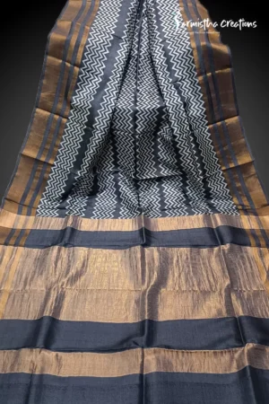 Hand block printed zari border tassar saree with Silk Mark certification.