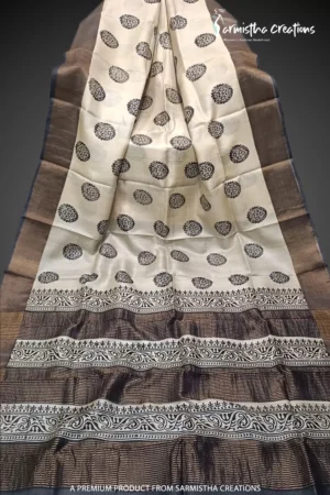 Hand block printed zari border tassar saree with Silk Mark certification.