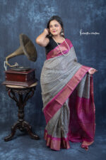 A bestselling blend of tradition and elegance, Royal Raga is a block printed zari Tussar silk saree featuring heritage patterns and a bold wine pallu.