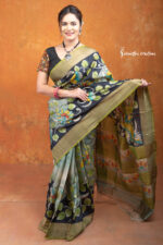 This is a Silk Mark certified zari tussar saree with hand painted kalamkari in multicolour on a pistachio green base.