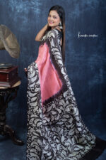 Noor-e-Nazaakat – a hand batik Bishnupuri silk saree in coral & black. Silk Mark Certified, perfect for elegant occasions. Shop handcrafted heritage now