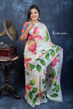 Ivory silk, joyful florals, and a whisper of spring. Spring Sonata is a timeless hand-painted Murshidabad silk saree, born of Bengal's artistry.