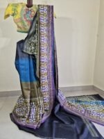 pure Gachi Tussar Kantha saree featuring an exquisite fusion dye that seamlessly transitions between royal blue, mehendi green, purple, and charcoal black